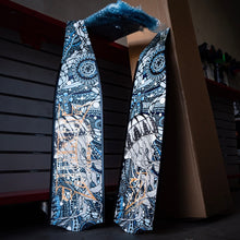 Load image into Gallery viewer, full view of aimrite freediving fins (aqua jelly) with workshop background
