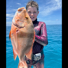 Load image into Gallery viewer, Person holding a large fish above water with a blue background