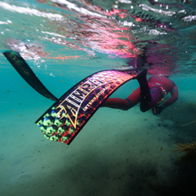 Load image into Gallery viewer, diver snorkeling in water wearing aimrite freediving fins (hex inferno)