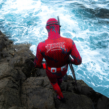Load image into Gallery viewer, red/purple 3mm wetsuit for spearfishing, lifestyle background