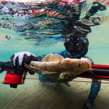 Load image into Gallery viewer, Diver in water holding vengeance roller and flathead