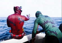 Load image into Gallery viewer, Divers wearing aimrite blue/reen & red/purple 3.0mm spearing wetsuits. lifestyle photo