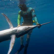Load image into Gallery viewer, Blue/green 3mm wetsuit for spearfishing, in water with marlin