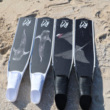 Load image into Gallery viewer, Reef addicts freediving and spearfishing fins, eagle ray and whale shark designs, on sand
