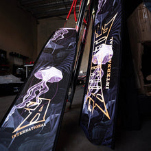 Load image into Gallery viewer, aimrite Freediving and spearfishing fins,  (purple jellyfish) full view with workshop background

