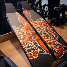 Load image into Gallery viewer, aimrite Freediving and spearfishing fins,  (orange octopus) full view with workshop background

