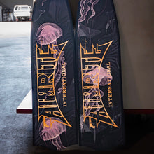 Load image into Gallery viewer, aimrite Freediving and spearfishing fins,  (purple jellyfish) with workshop background

