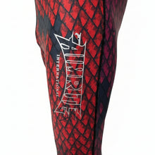 Load image into Gallery viewer, Aimrite red/purple stinger suit close up of left side pants aimrite logo
