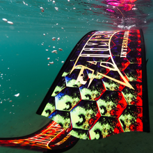 Load image into Gallery viewer, close up view of aimrite feediving fins (hex inferno) in water
